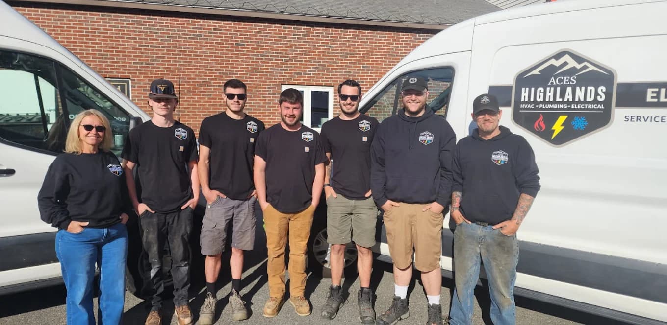 The Aces Highlands team in front of their service vans